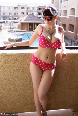 41259684 002 1709 262x388 - Busty amateur chick Susy Rocks shows herself shades clad in a polka-dot bikini on the balcony
