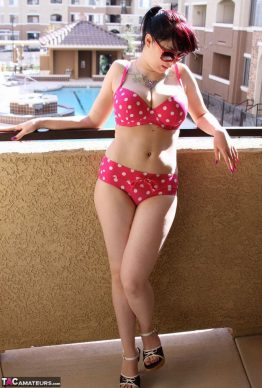41259684 003 fca4 262x388 - Busty amateur chick Susy Rocks shows herself shades clad in a polka-dot bikini on the balcony