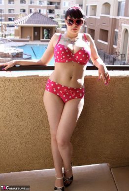 41259684 004 1188 262x388 - Busty amateur chick Susy Rocks shows herself shades clad in a polka-dot bikini on the balcony