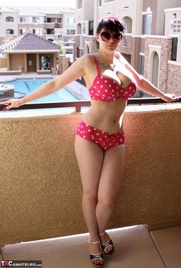 41259684 006 8612 262x388 - Busty amateur chick Susy Rocks shows herself shades clad in a polka-dot bikini on the balcony