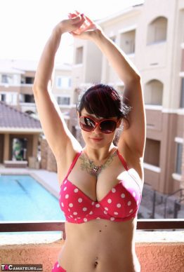 41259684 011 09e9 262x388 - Busty amateur chick Susy Rocks shows herself shades clad in a polka-dot bikini on the balcony